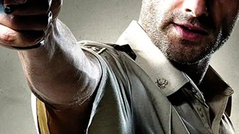 Rick Grimes empuña su arma en The Walking Dead Rick Grimes empuña su arma en The Walking Dead